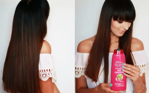 Długie włosy kobiety lśnią dzięki szamponowi Garnier Fructis.