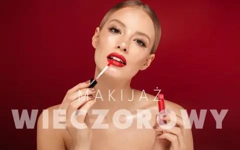 Kobieta nakłada czerwoną szminkę, tworząc idealny makijaż wieczorowy.